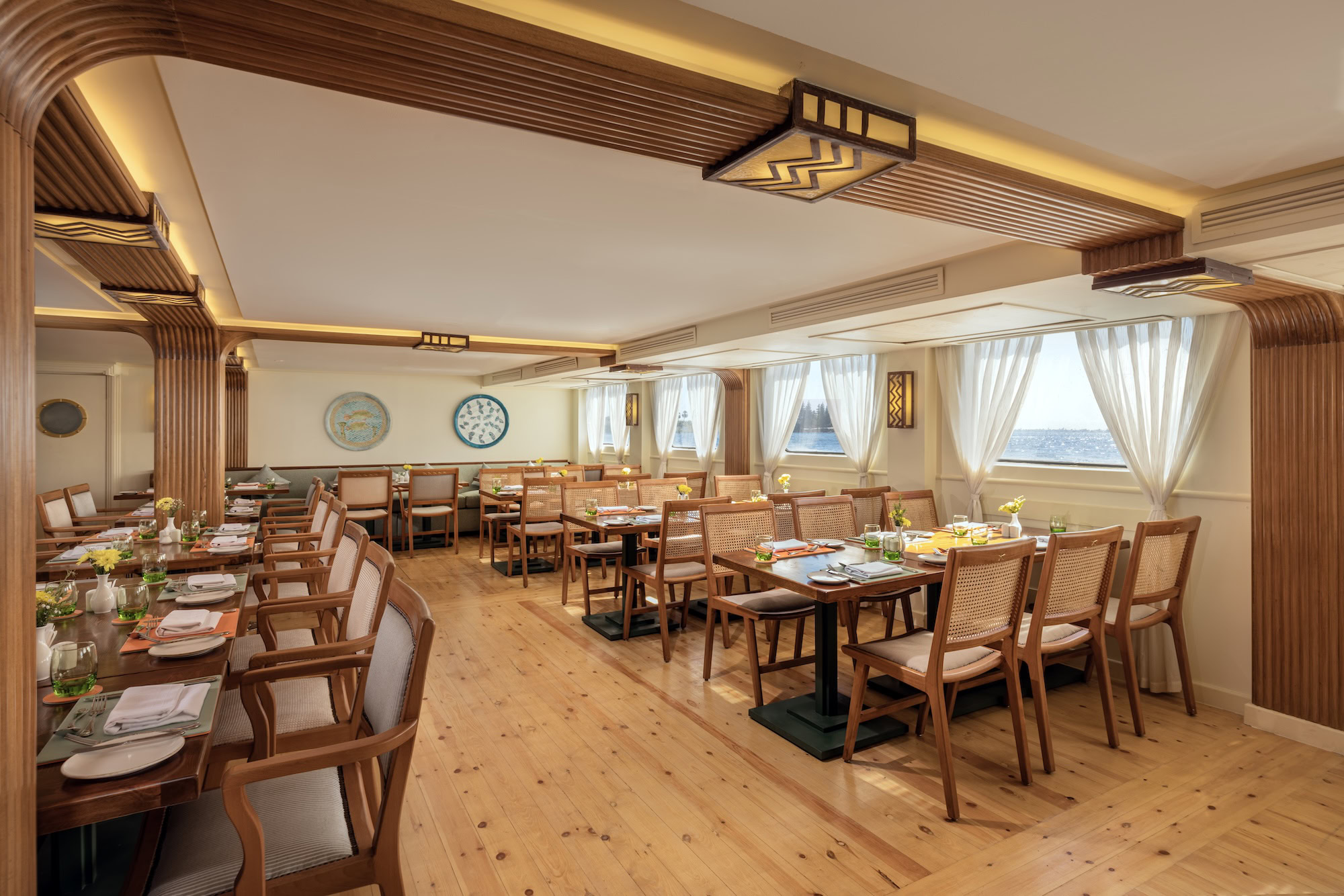 Elegant restaurant interior aboard a luxury Nile cruise ship with dining tables and windows
