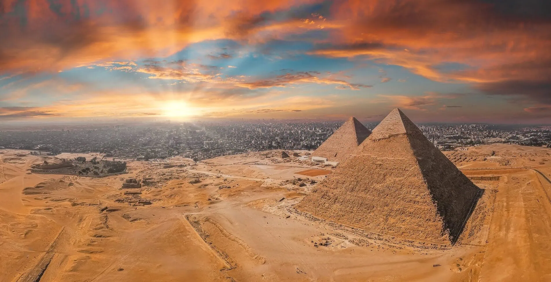 Magical sunset over the Egyptian pyramids. Aerial view of the Pyramids of Giza in Egypt