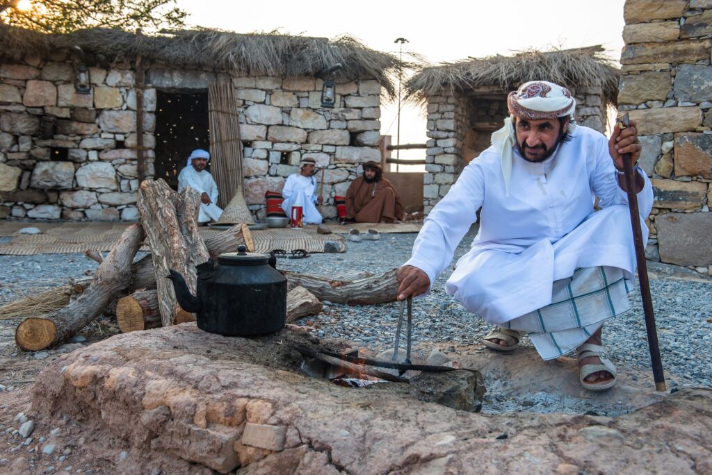 Man lights the fire as traditional activities at Heritage Village Dubai UAE