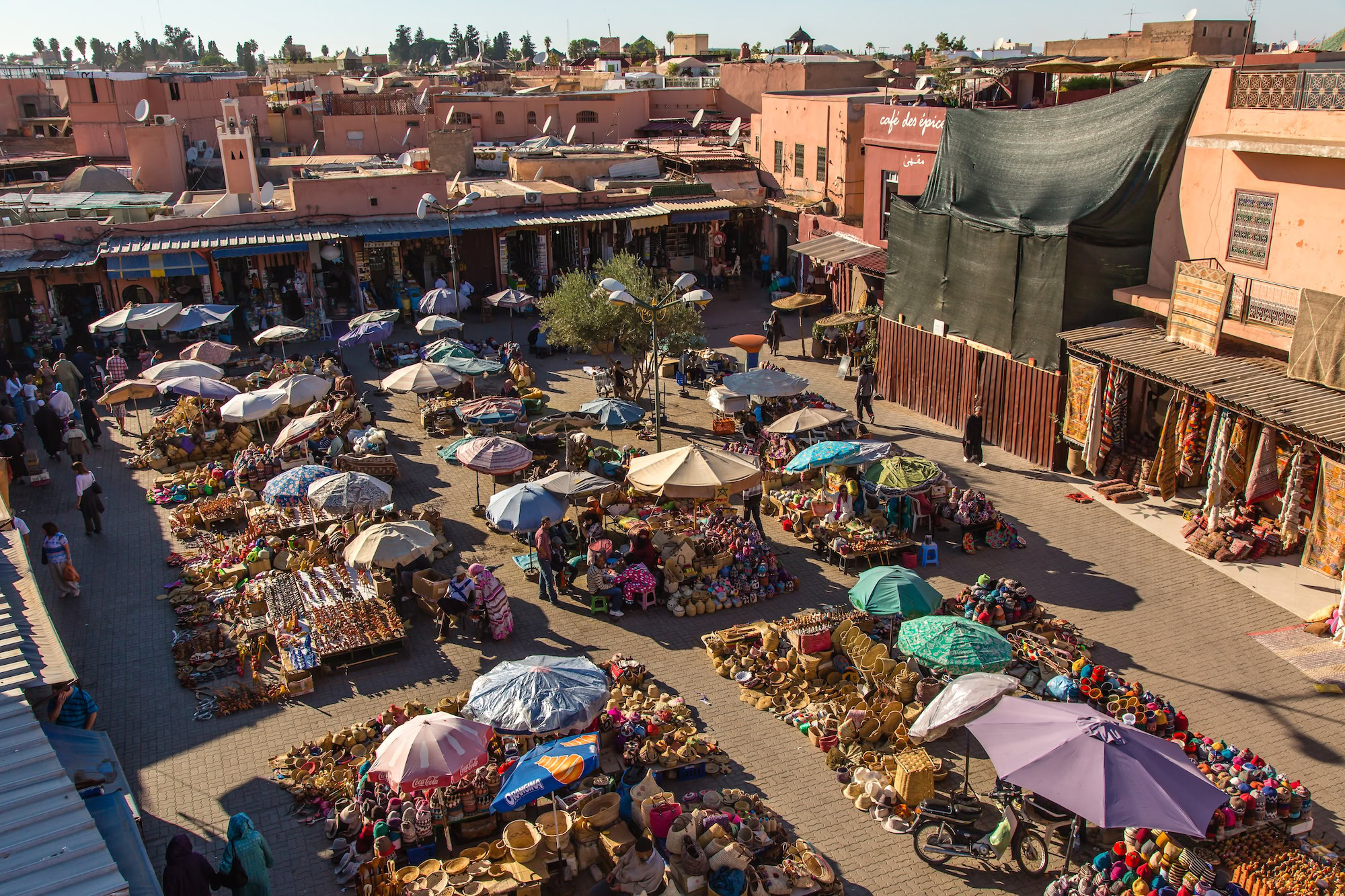 Aerial view of bustling Jemaa el-Fnaa market square in Marrakech with food stalls and vendors