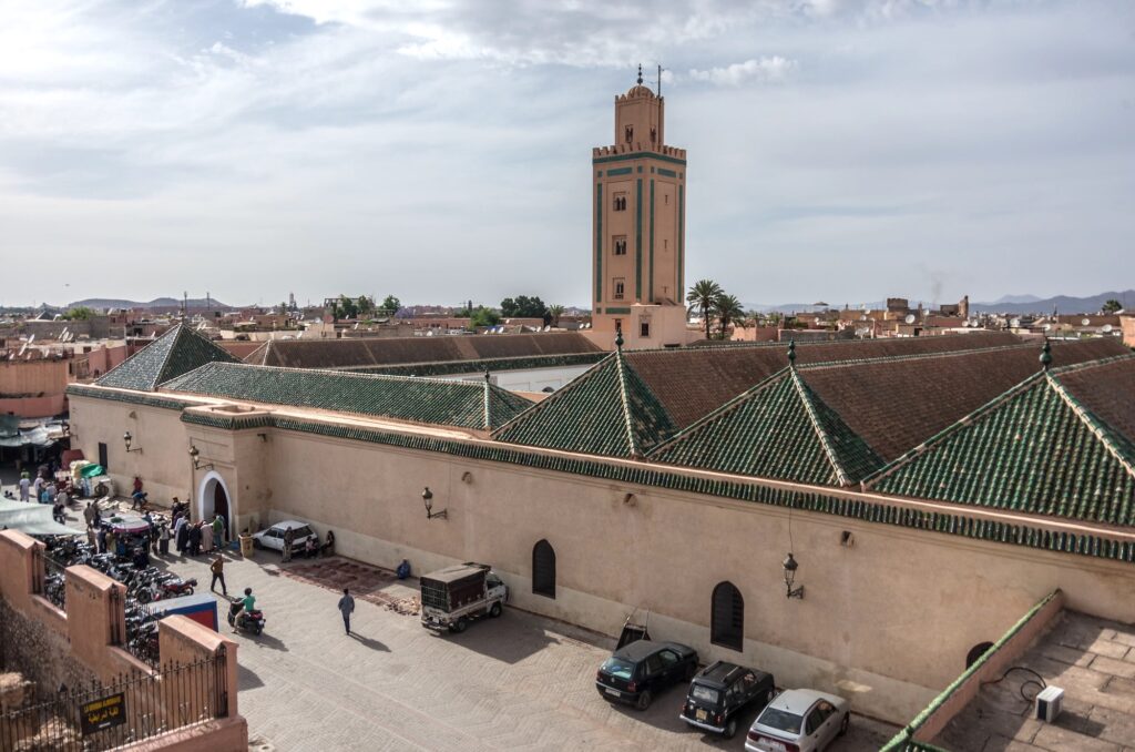 Marrakesh Morocco May 3 2017 Roof and minaret of Mosque of Ben Youssef view from neighbors roof
