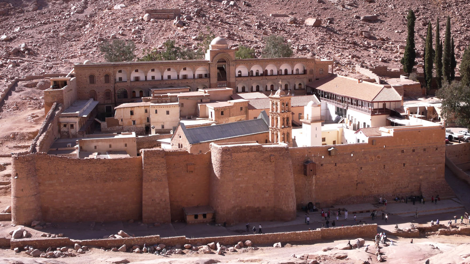 Saint Catherine's Monastery with its ancient stone walls and bell tower nestled against desert mountains