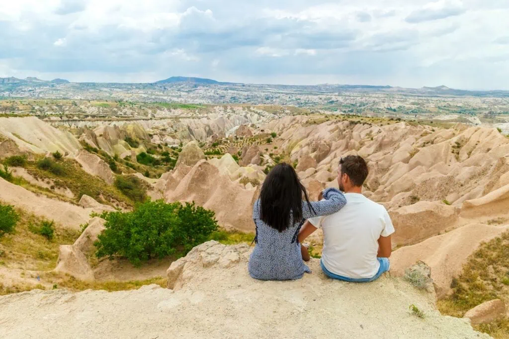 Monks Valley happy young couple on vacation in Turkey
