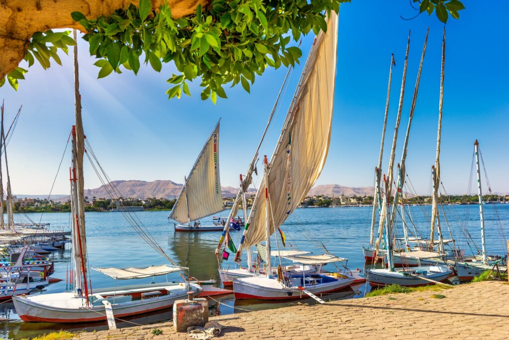 Moored sailboats on riverbank of Nile in Luxor