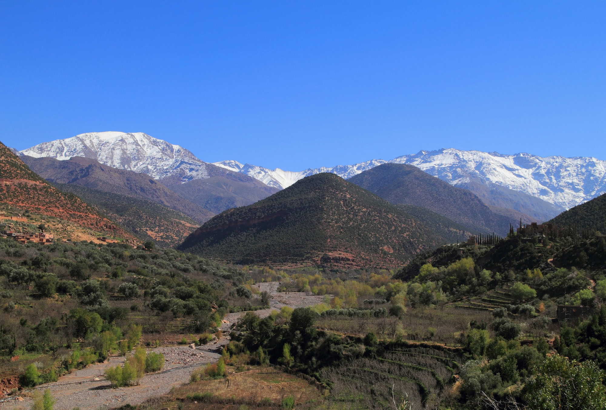 Snow-capped Atlas Mountains with terraced valleys in Morocco
