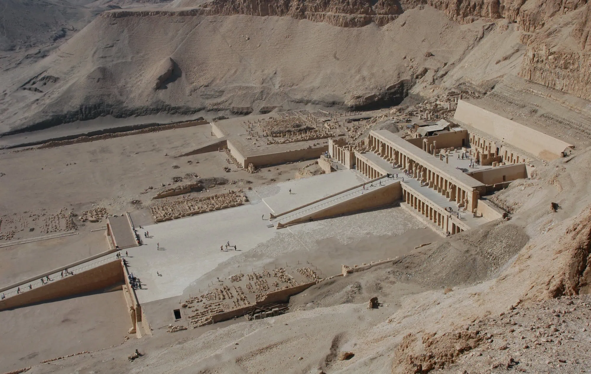 Temple of Queen Hatshepsut with limestone terraces, columns and tourists at the ancient site