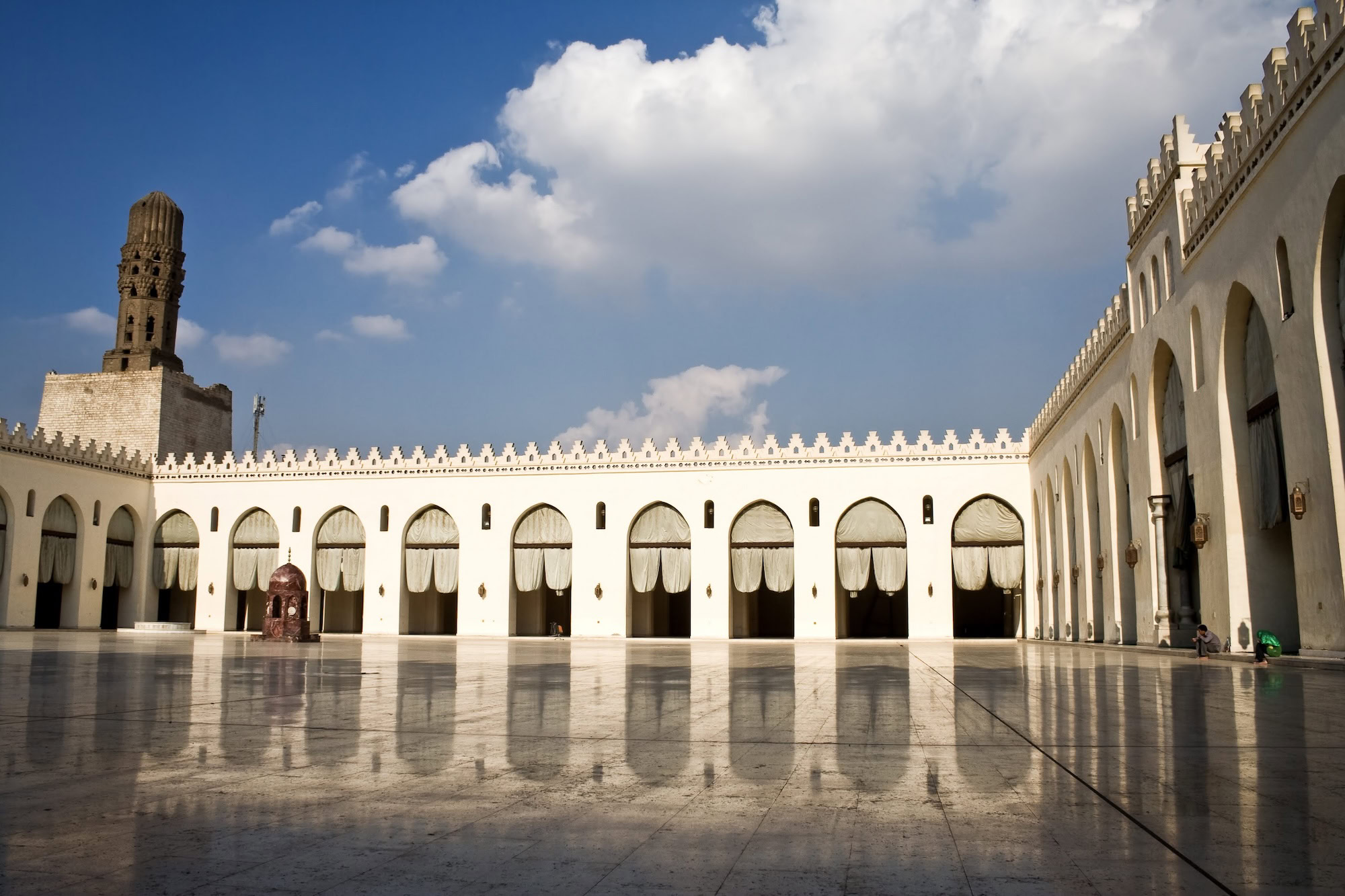 Al-Hakim Mosque in Cairo showing white marble architecture and Islamic design elements