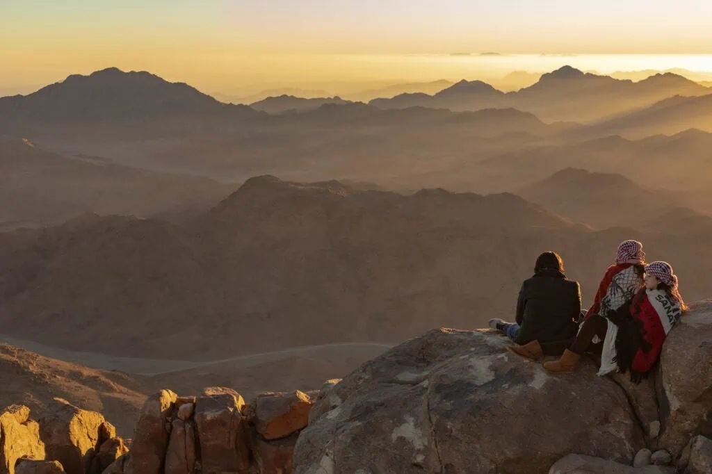Sunrise casting warm light over the peaks of Mount Sinai