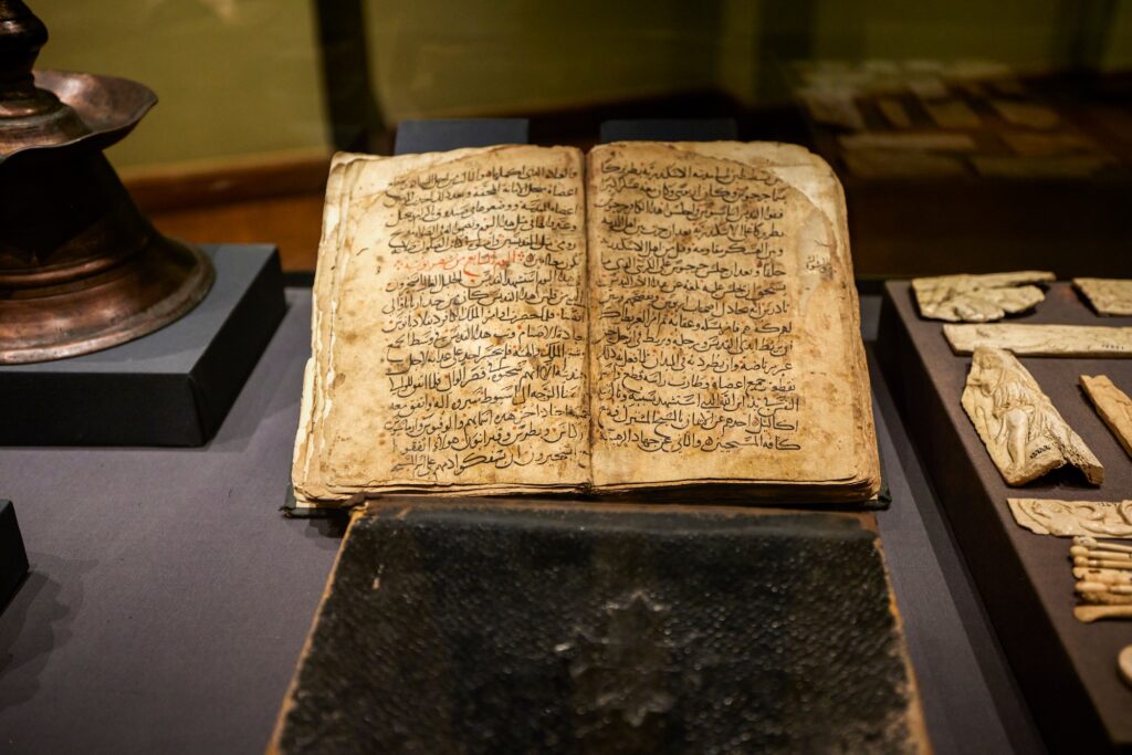 Books displayed in glass cases inside the National Museum of Alexandria, Alexandria