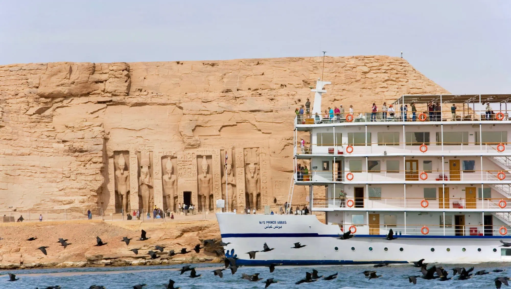 Abu Simbel temple with white Nile cruise ship on Lake Nasser