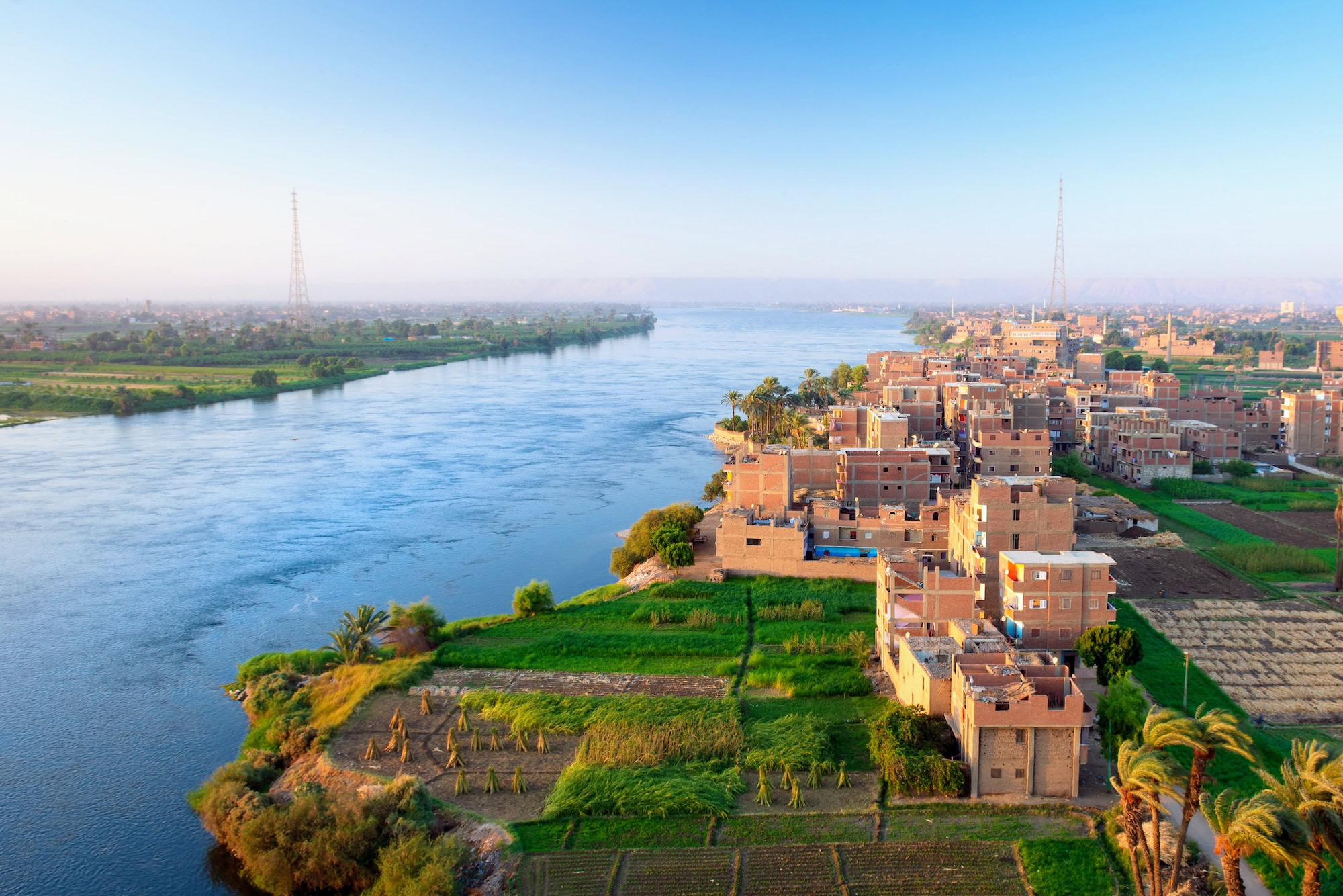 Aerial view of the Nile River showing agricultural fields, villages, and bridge infrastructure