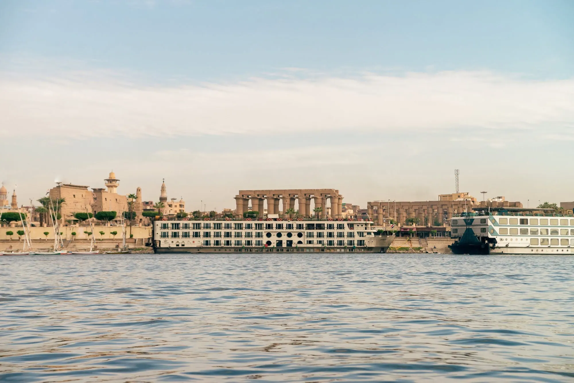Ancient Luxor Temple with columns viewed from the Nile River's east bank