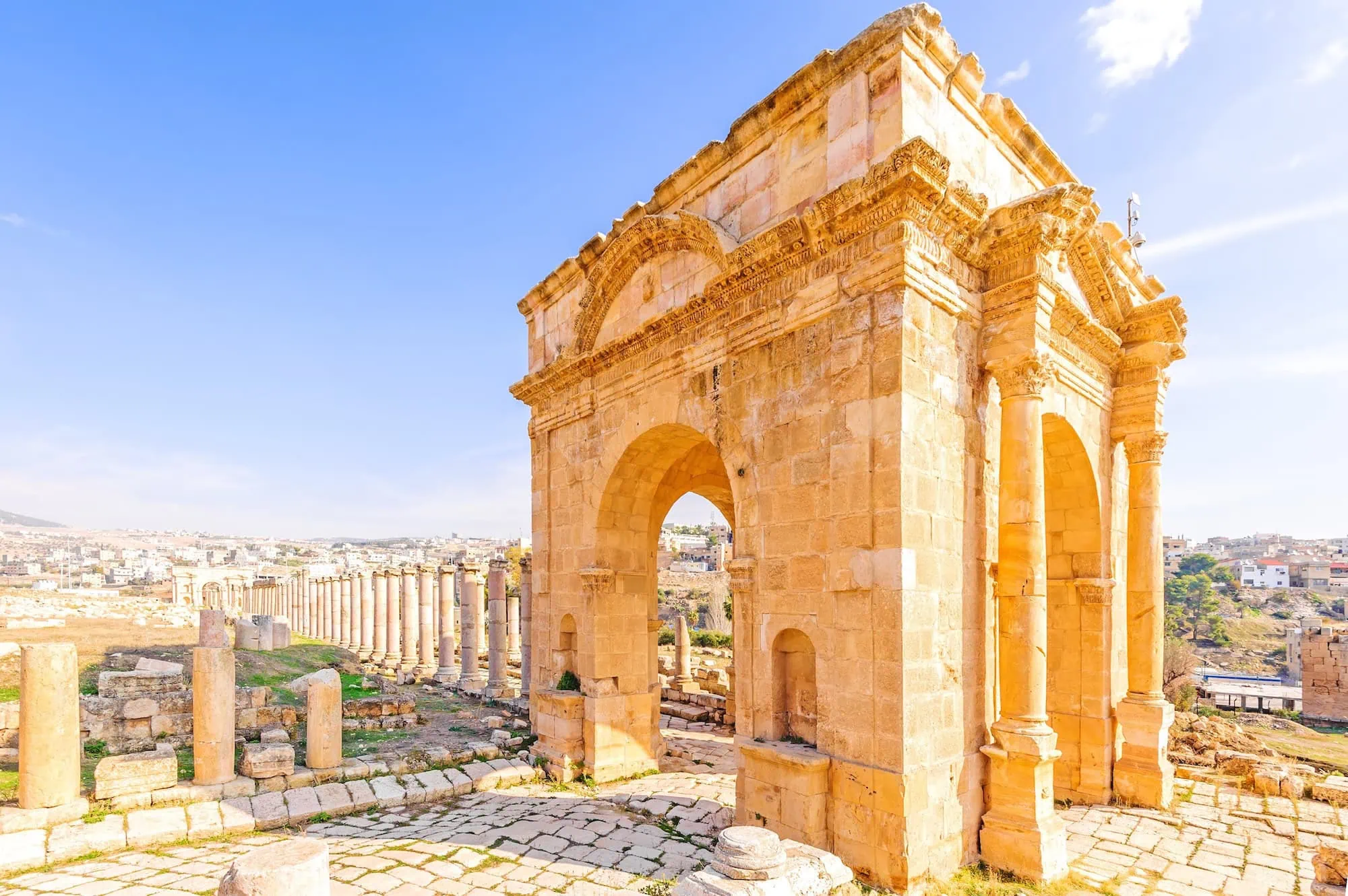 Ancient Roman colonnade and arch at Jerash Archaeological Site, Jordan