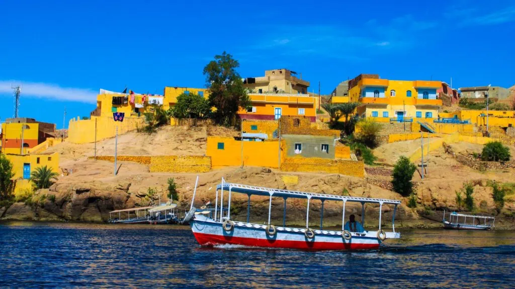 Colorful painted houses and waterfront setting in a Nubian Traditional Village on Lake Nasser, Aswan
