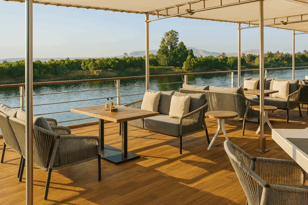 Open deck of the Oberoi Zahra Nile cruise ship with seating and river views along the Nile Luxor