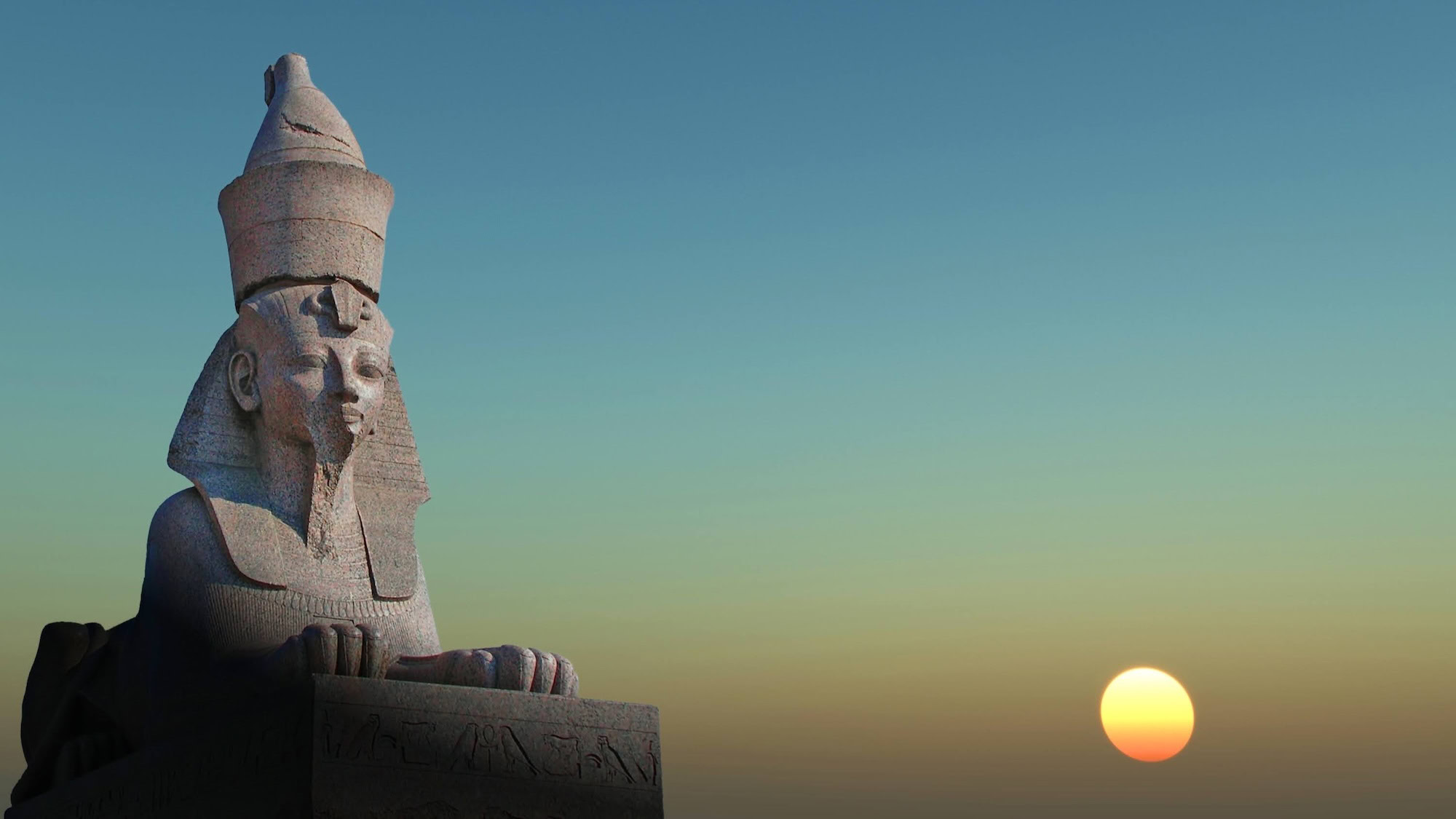 Sphinx statue in Egyptian desert under bright sunny sky