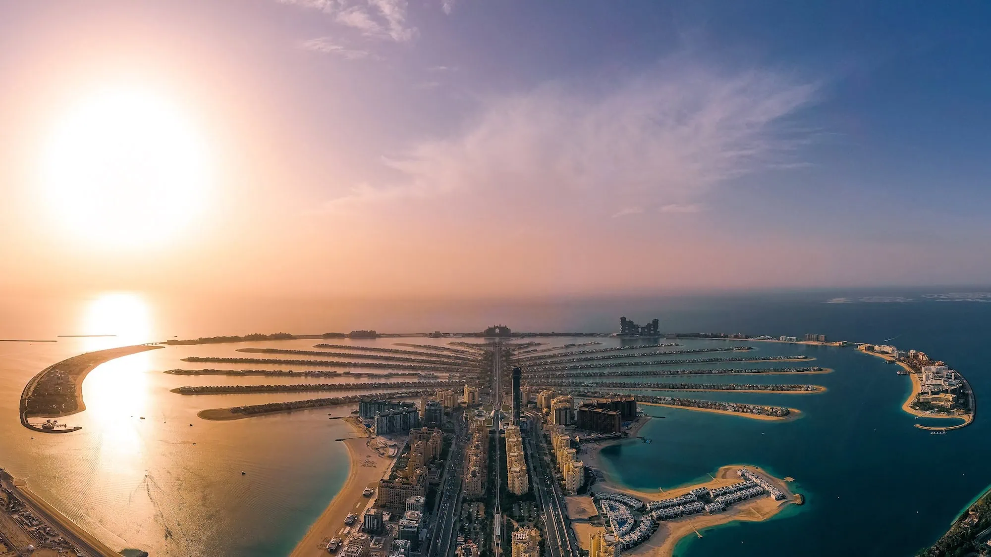 Aerial view of Dubai's iconic Palm Jumeirah artificial island with hotels and coastline