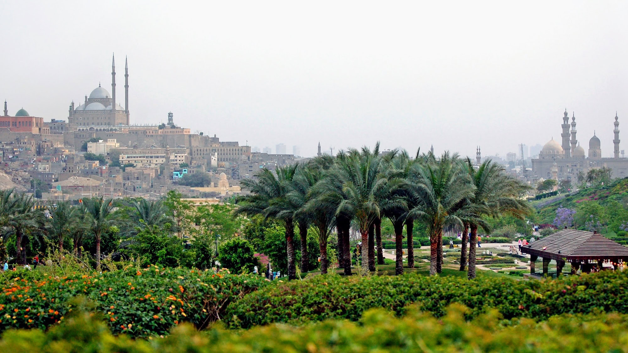 Mosque with minarets and dome situated on elevated Citadel of Saladin surrounded by gardens