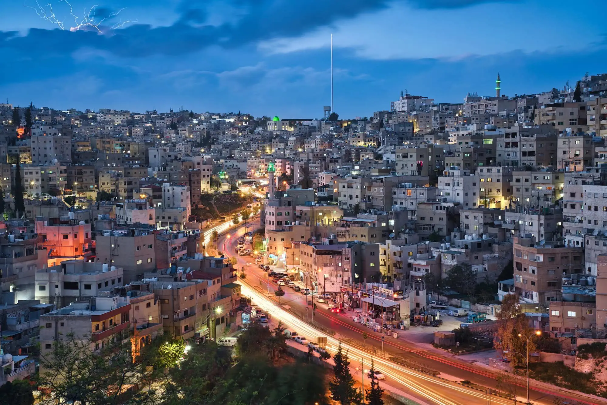 Panoramic view of Amman city at sunset showing urban infrastructure and buildings