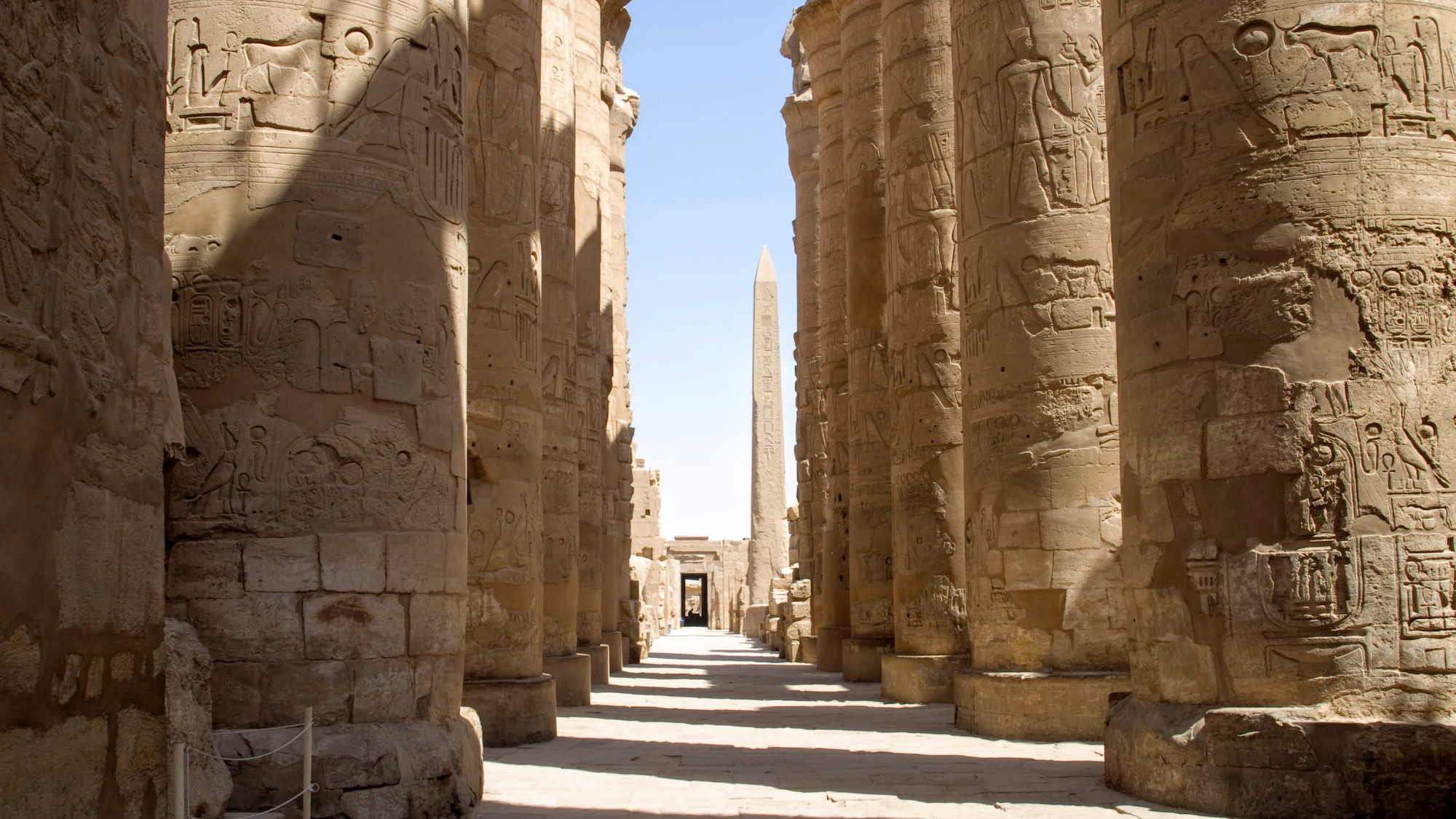 Massive Karnak Temple complex with towering ancient columns and hieroglyphic carvings