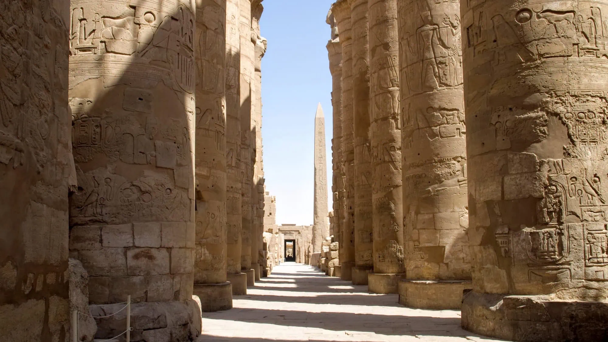 Massive Karnak Temple complex with towering ancient columns and hieroglyphic carvings