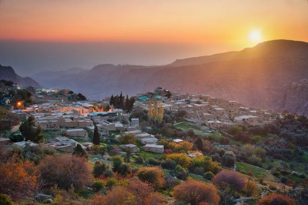 Stone houses of Dana Village at sunset with surrounding hills in Dana Biosphere Reserve, Dana