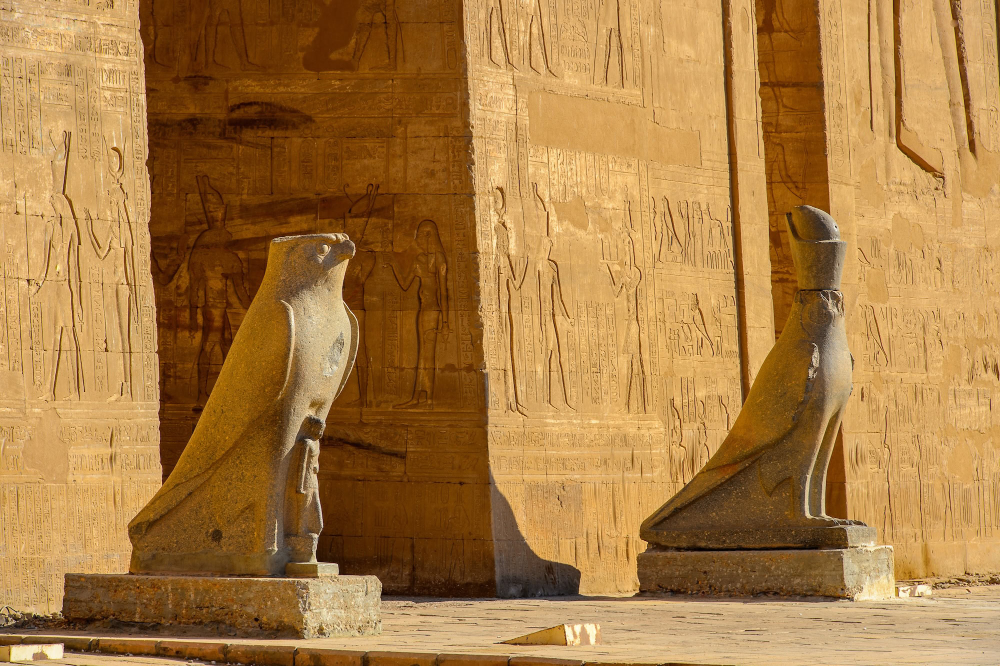 Stone falcon statues of Horus at the ancient Egyptian Temple of Horus in Edfu