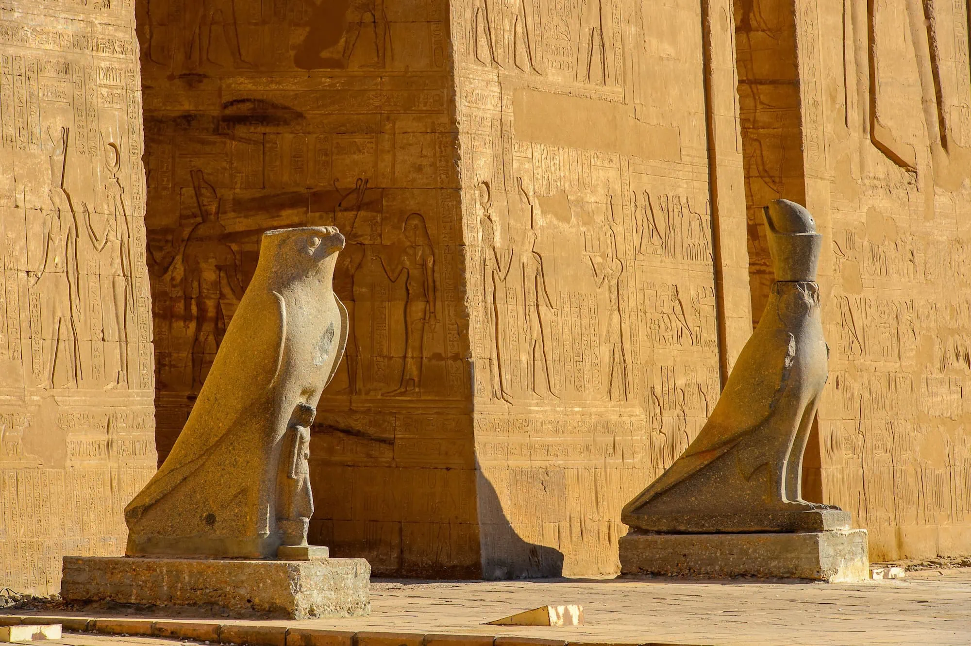 Stone falcon statues of Horus at the ancient Egyptian Temple of Horus in Edfu
