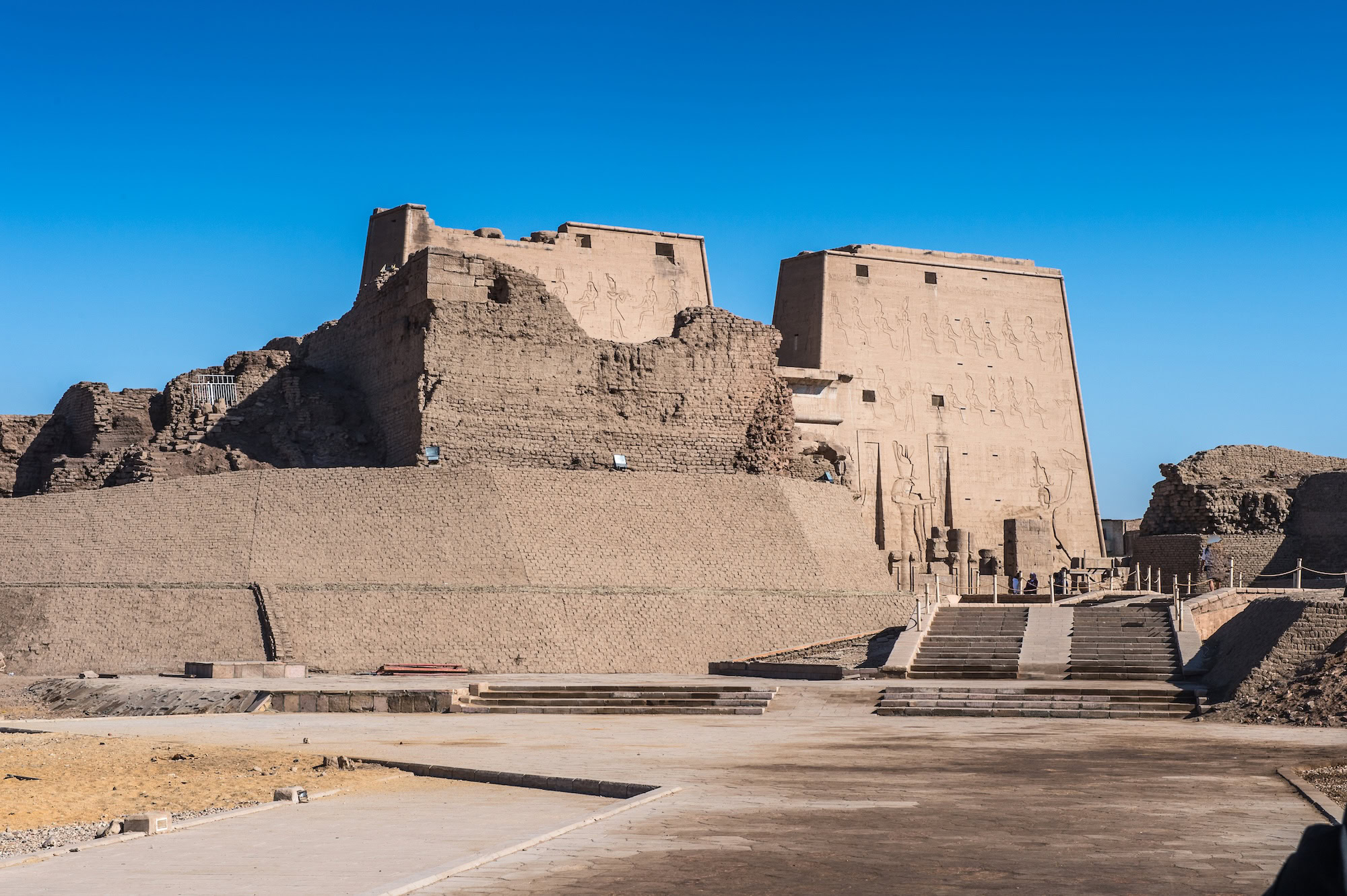 Ancient stone walls and stairs of Edfu Temple with hieroglyphic carvings