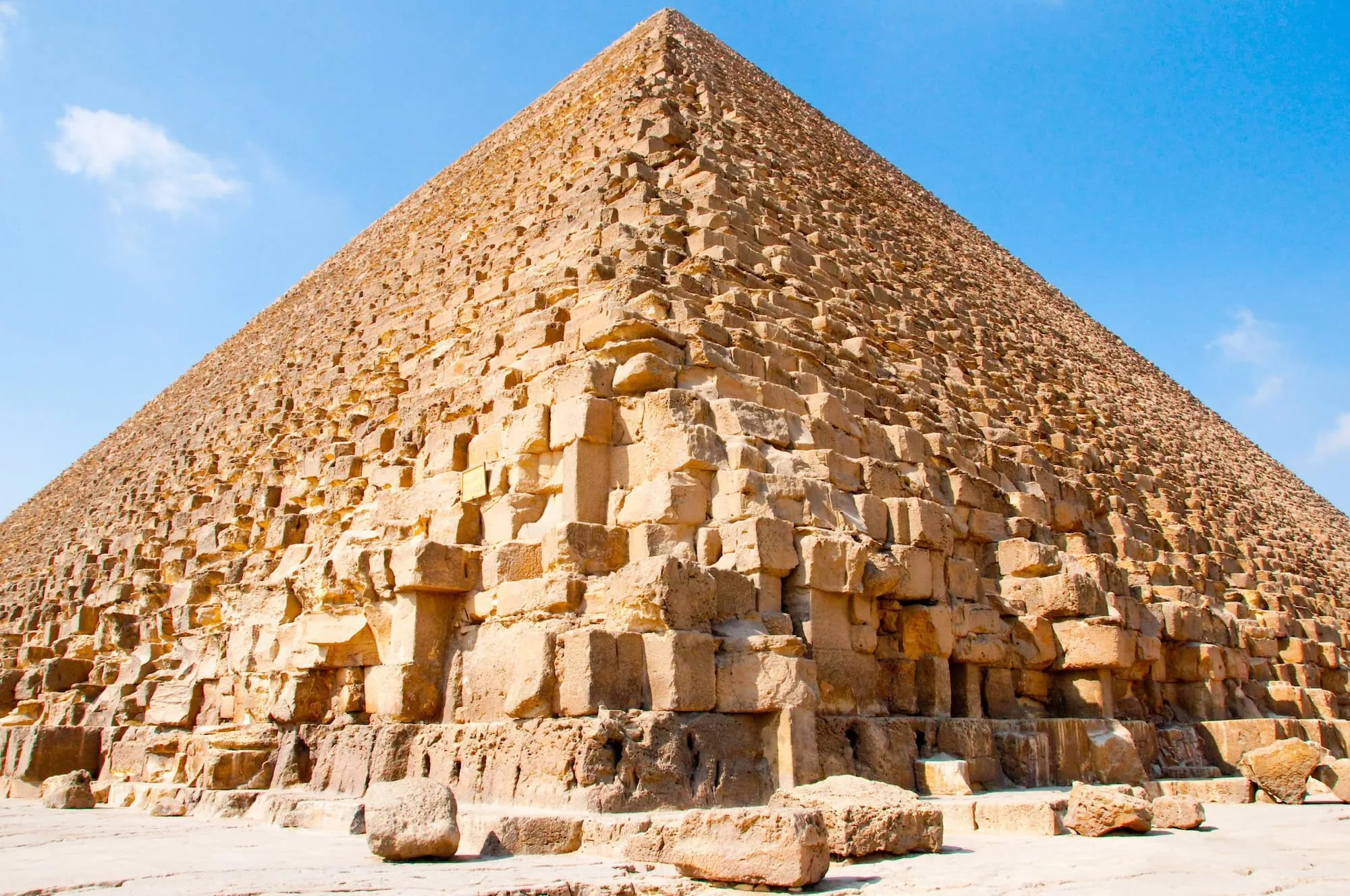 Majestic Great Pyramid of Giza showing detailed limestone blocks against blue sky