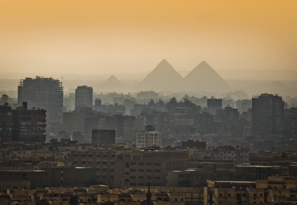 Pyramids of Giza partially covered in morning mist, Cairo