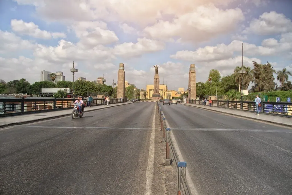 View from Qasr El Nil Bridge toward the statue of Saad Zaghloul at Opera Square with surrounding urban scenery, Qasr El Nil Bridge, Cairo