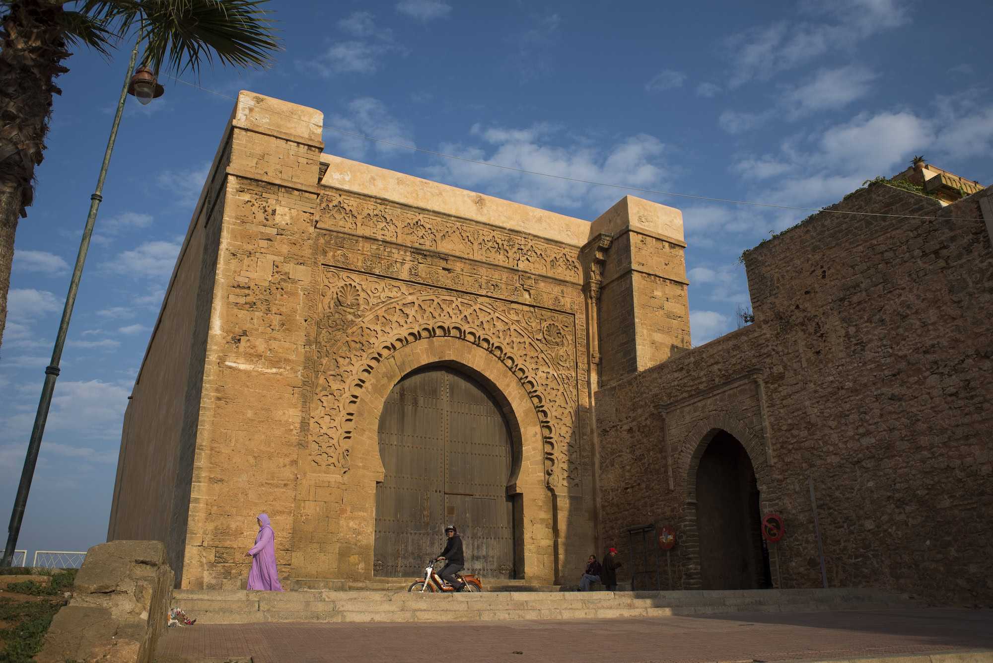 Historic Bab Agnaou Gate in Marrakech with traditional stone arch and fortress walls