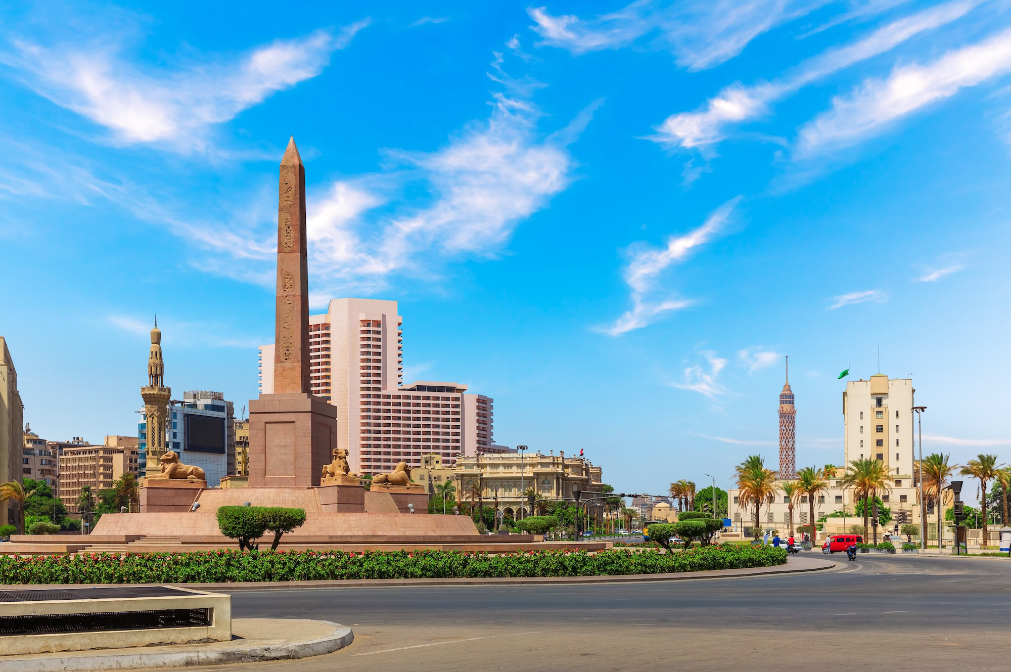 Modern Cairo cityscape with obelisk and urban landmarks in Tahrir Square