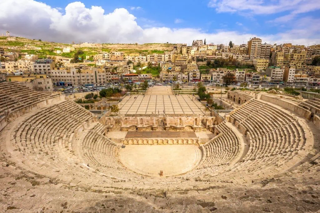 Stone seating tiers of the Roman Theatre carved into a hillside in Amman
