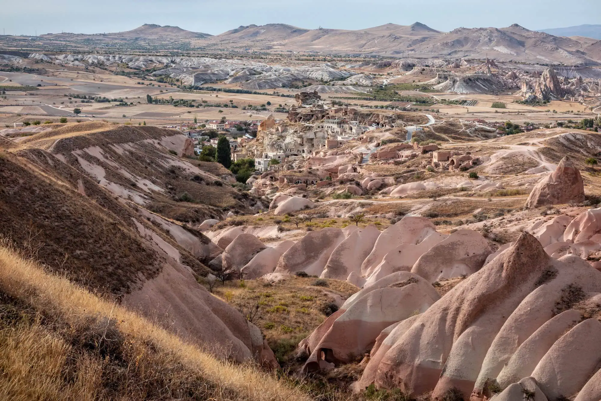 Panoramic view of Rose Valley near Cavusin showing fairy chimney rock formations and cave dwellings