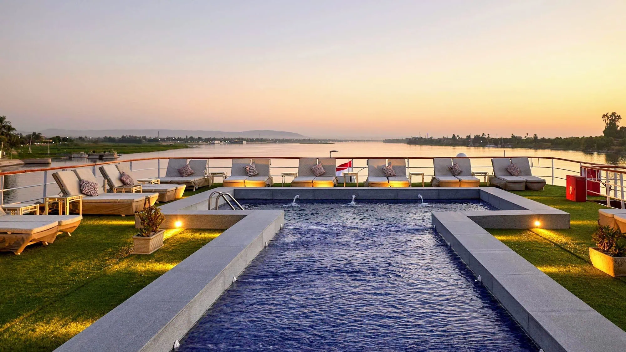 Luxurious Nile River cruise ship deck with swimming pool and modern amenities