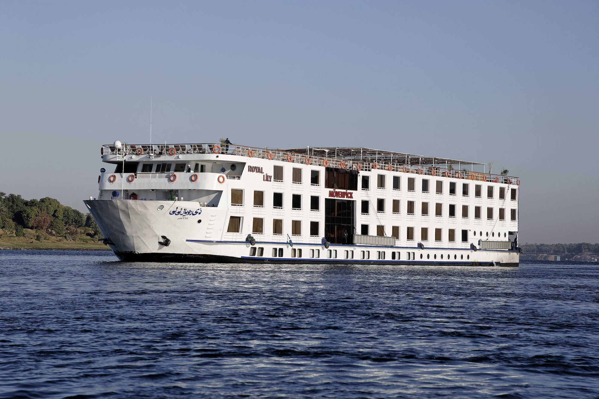 Nile River cruise ship sailing on calm waters in Egypt