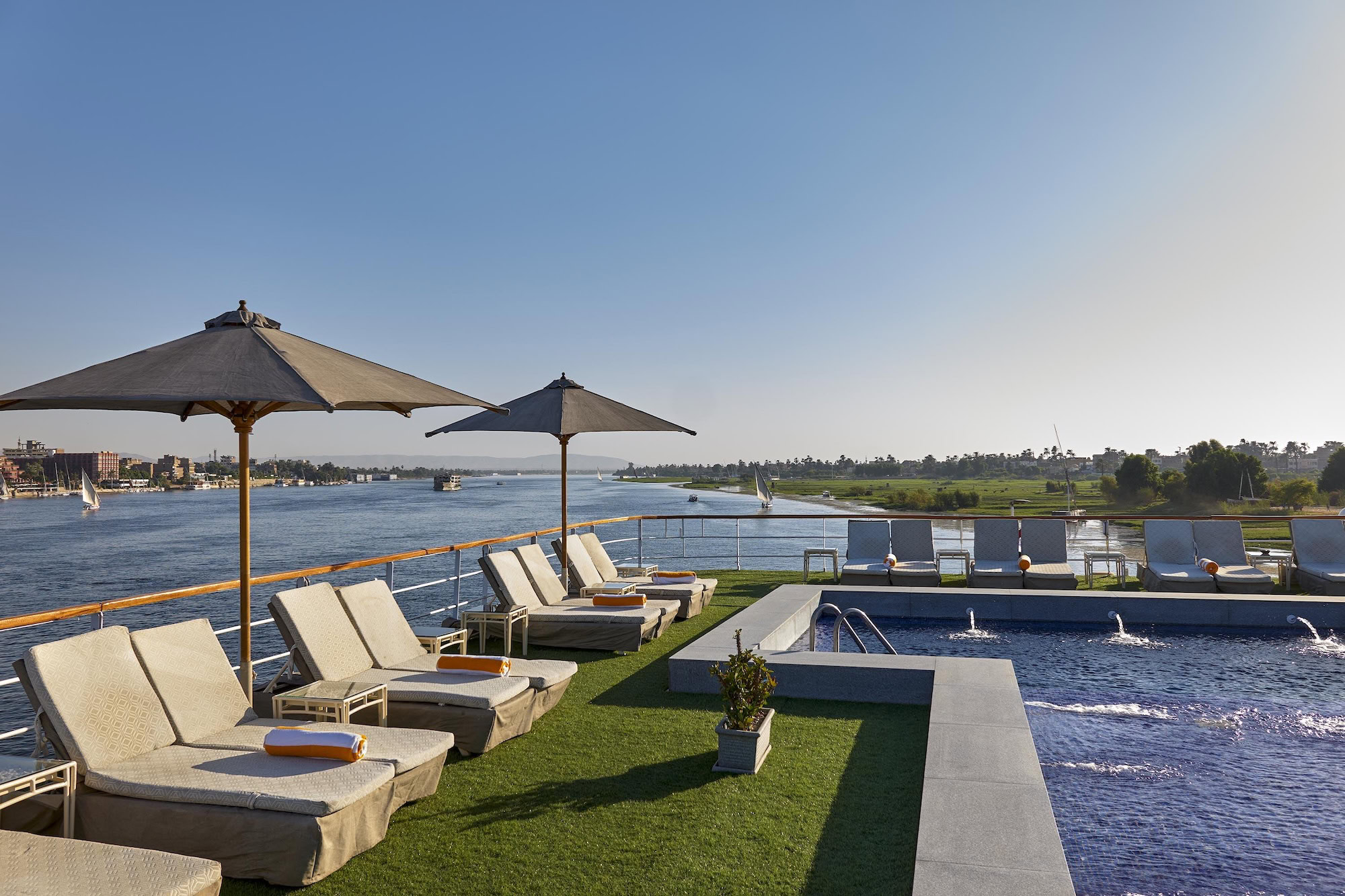Luxury Nile River cruise ship deck with pool and dining area