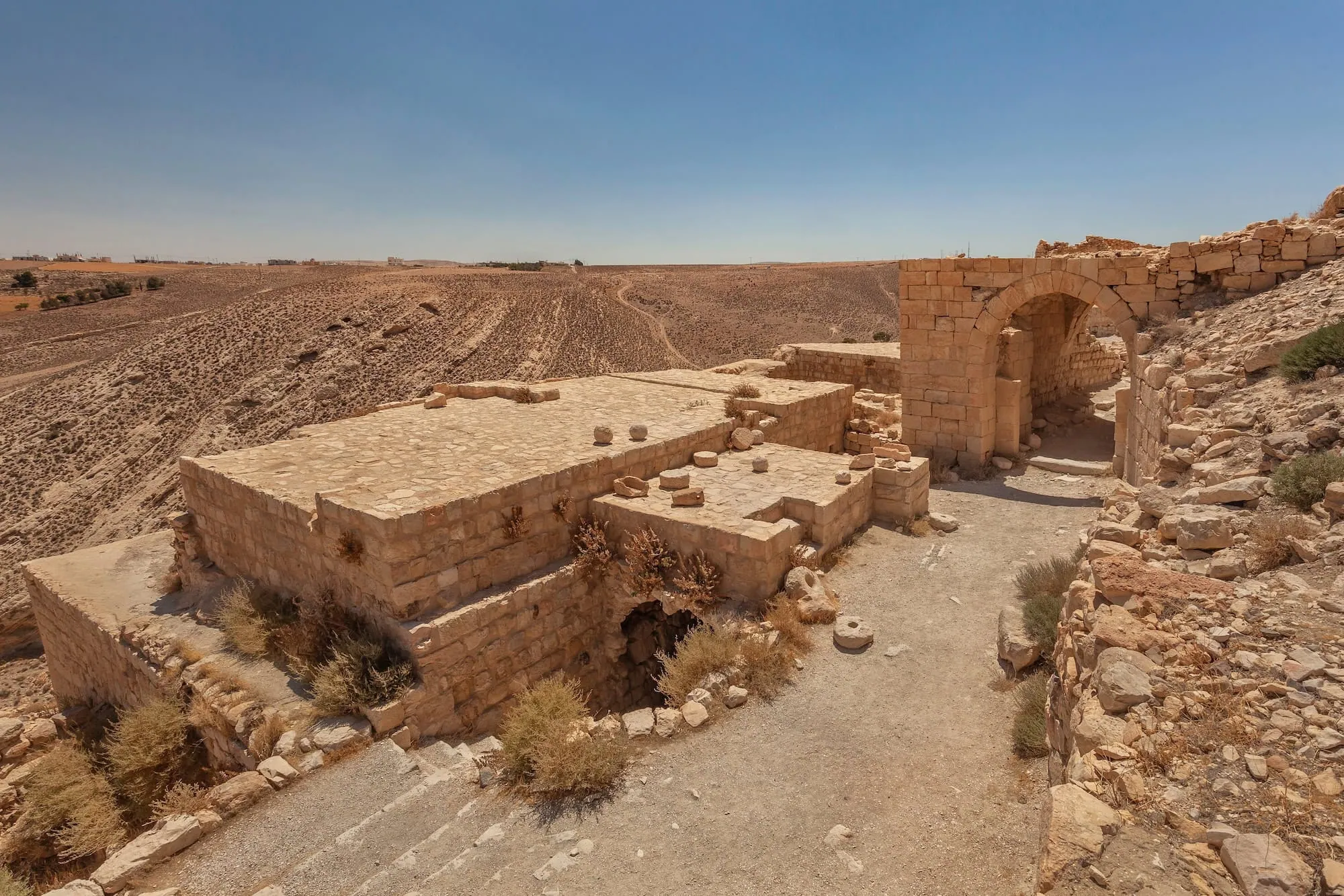Interior ruins of ancient stone castle with preserved walls and arched doorways