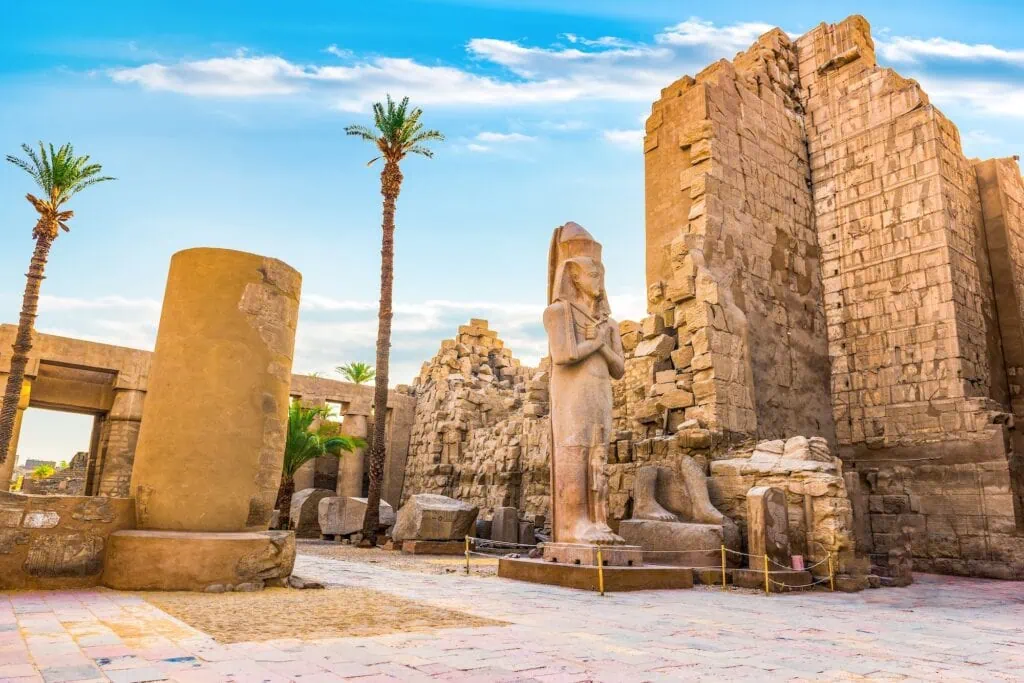 Ruins in Karnak Temple at sunrise in Luxor, Egypt – sunlit columns and ancient stonework featured on Egypt tours from Los Angeles.