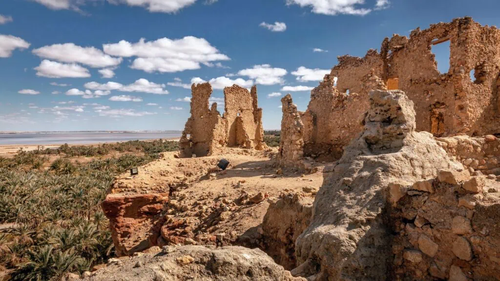 Ruins of the Temple of the Oracle at Siwa Oasis surrounded by desert landscape