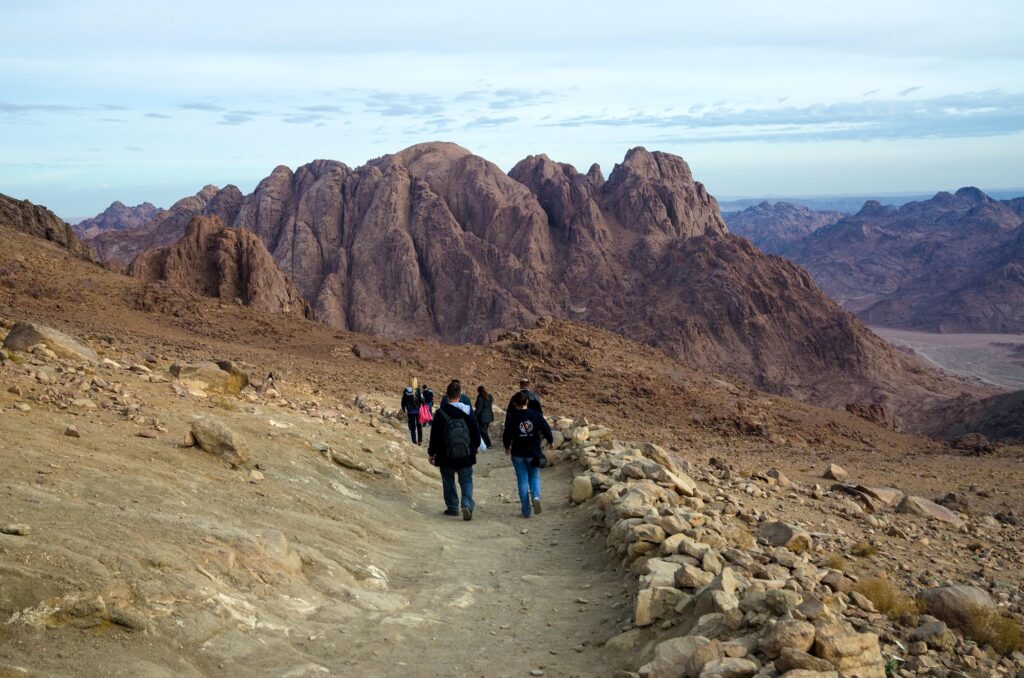 Tourists descending the rocky path on Moses Mountain