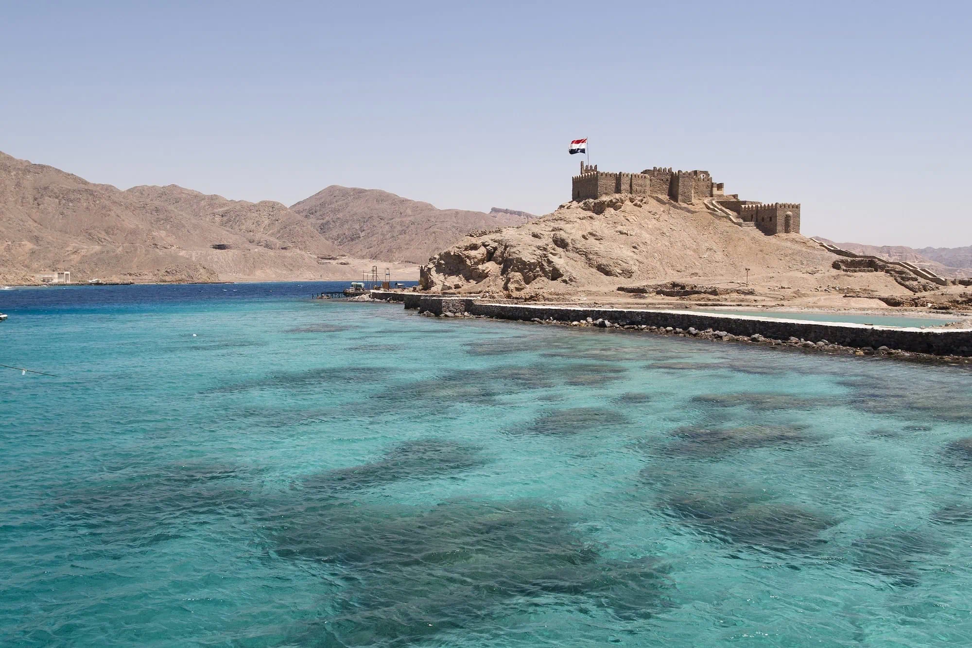 Salah El-Din Castle on Pharaoh's Island surrounded by turquoise waters of Gulf of Aqaba