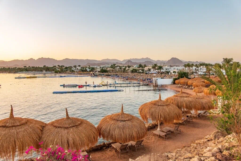 Beachfront view with resort buildings and surrounding mountains along Naama Bay, Sharm El Sheikh