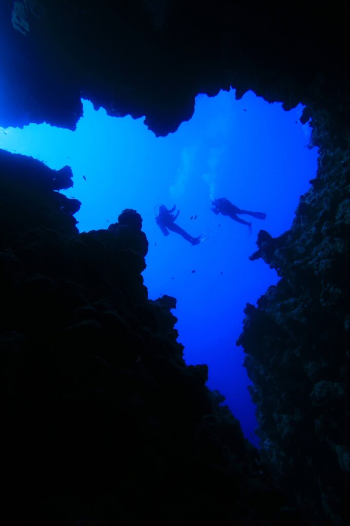 Scuba Divers prepare to descend into the Canyon a dive site in Dahab Egypt
