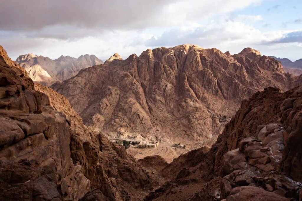 Top view of Mount Sinai near St. Catherine Monastery with the surrounding Sinai Mountains under a cloudy sky, Saint Catherine