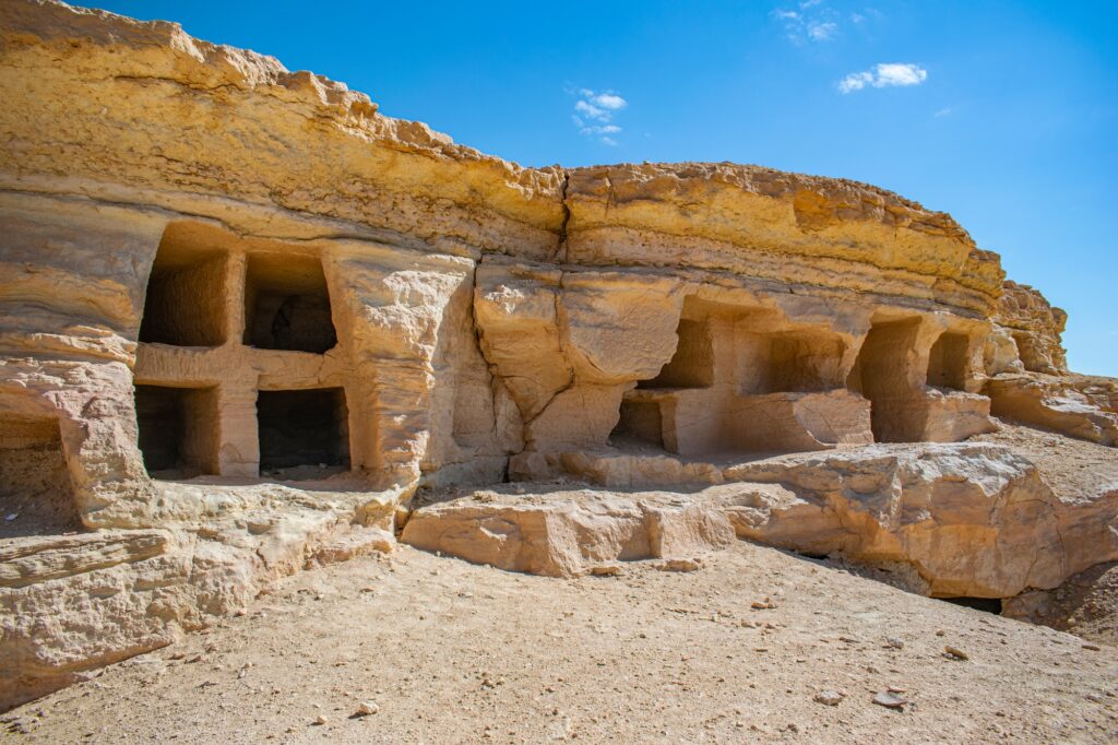 View of Gabal al-Mawta (Mountain of the Dead) with clustered tomb hills in the desert landscape, Siwa Oasis