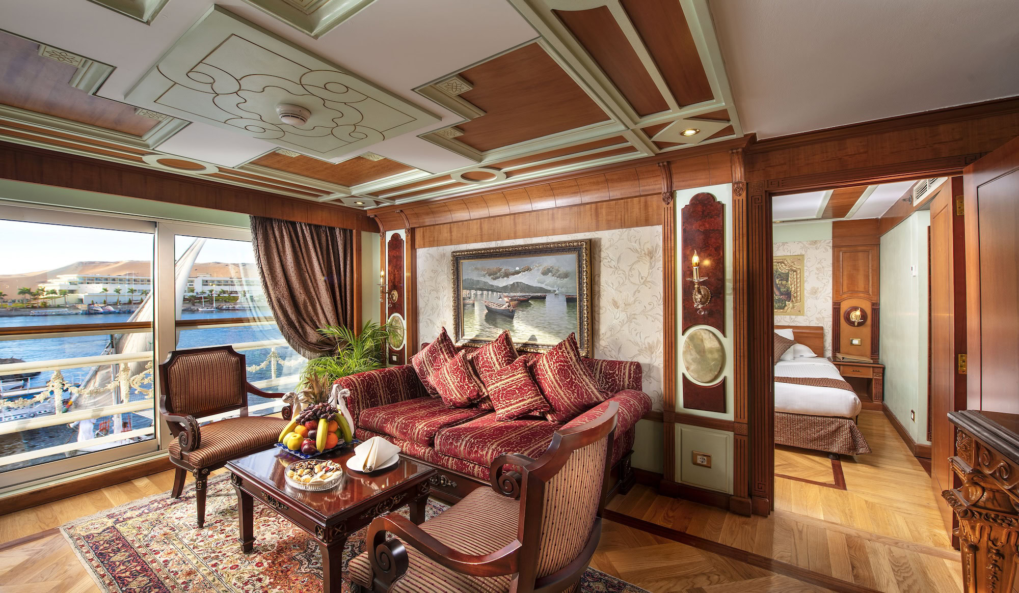Elegant interior of a luxury Nile River cruise ship cabin with sofa and river view