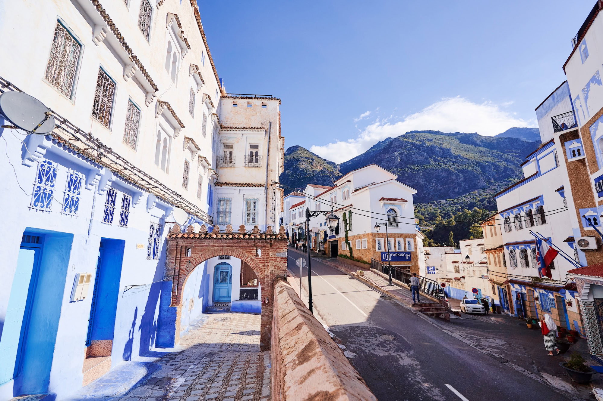 Blue and white painted buildings in Chefchaouen's medina with traditional Moroccan architecture